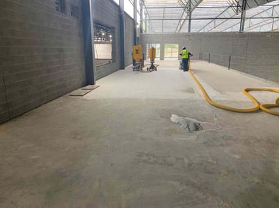 BUILDING 300- LOOKING WEST, CONCRETE GRINDING FOR