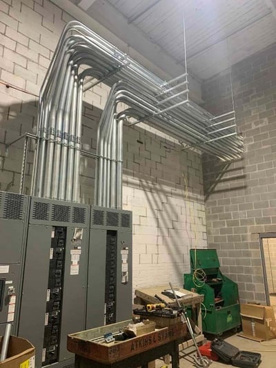 CONDUIT INSTALL ON EAST WALL OF MECHANICAL ROOM 107