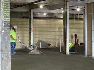 INSTALLATION OF CONCRETE TOPPING IN CONFERENCE AREA LOBBY