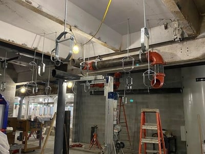 INSTALLATION OF GEOTHERMAL PIPING INTO MECHANICAL ROOM