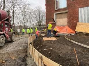 LOOKING EAST – INSTALLATION OF SIDEWALK – NORTH END OF BUIDLING