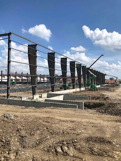 Standing up main columns and purlins in preparation for raising the girder beams