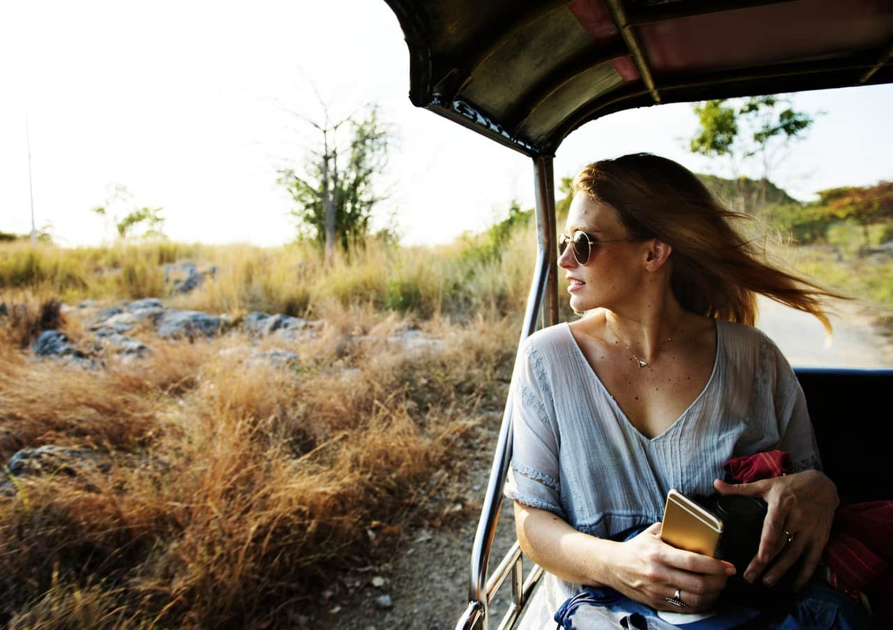 woman traveling in rickshaw