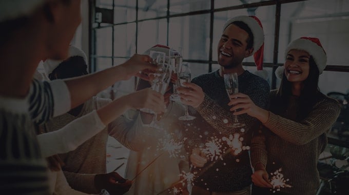 employees toasting champagne at a holiday party event