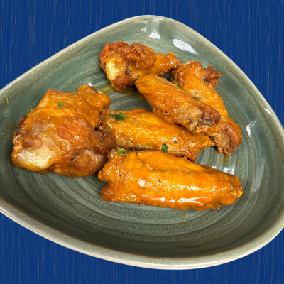Famous Hydraulic Bar chicken wings coated in buffalo sauce