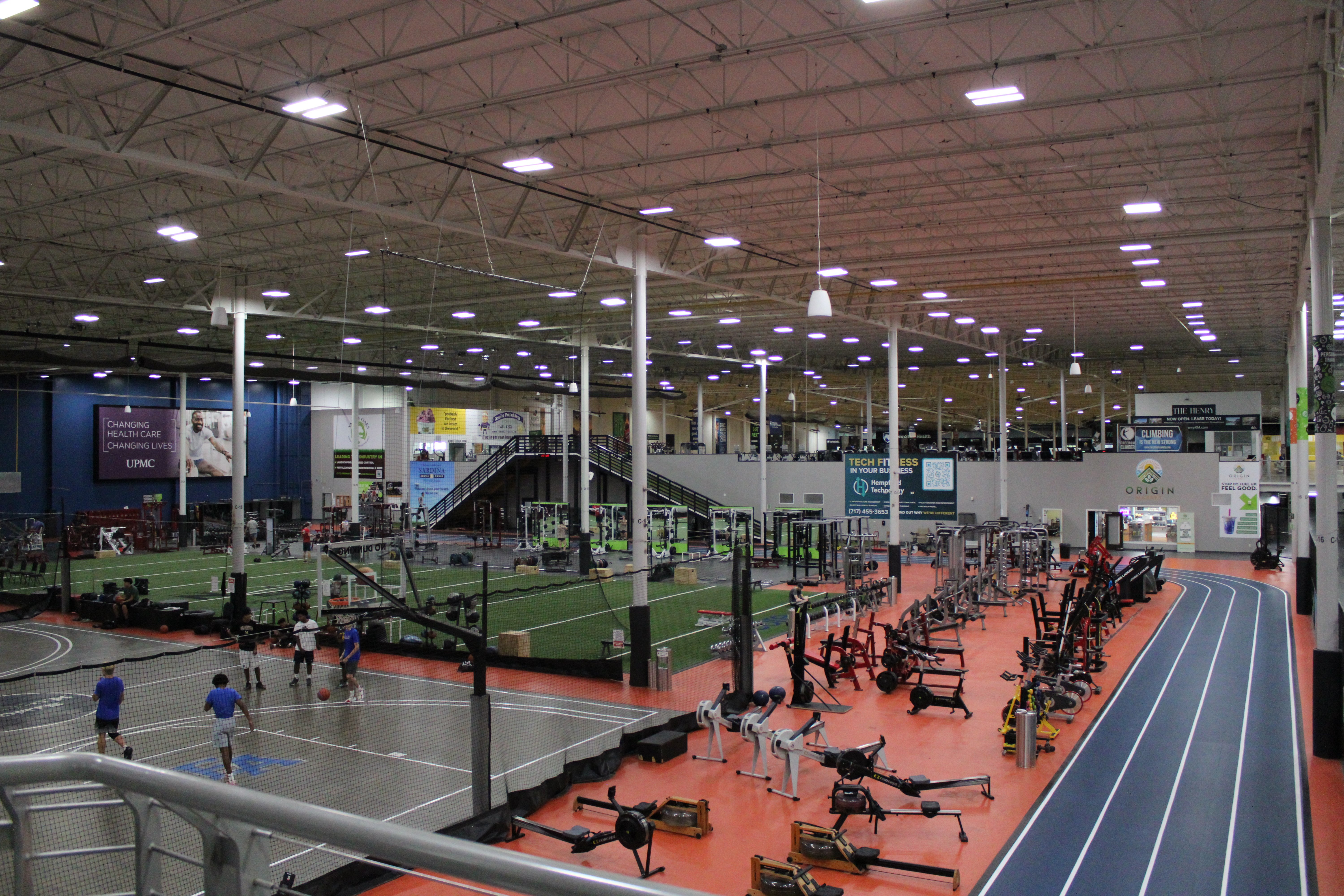 Overhead view of Spooky Nook Sports’ fitness center featuring strength training equipment, turf training areas, indoor courts, and an indoor running track.