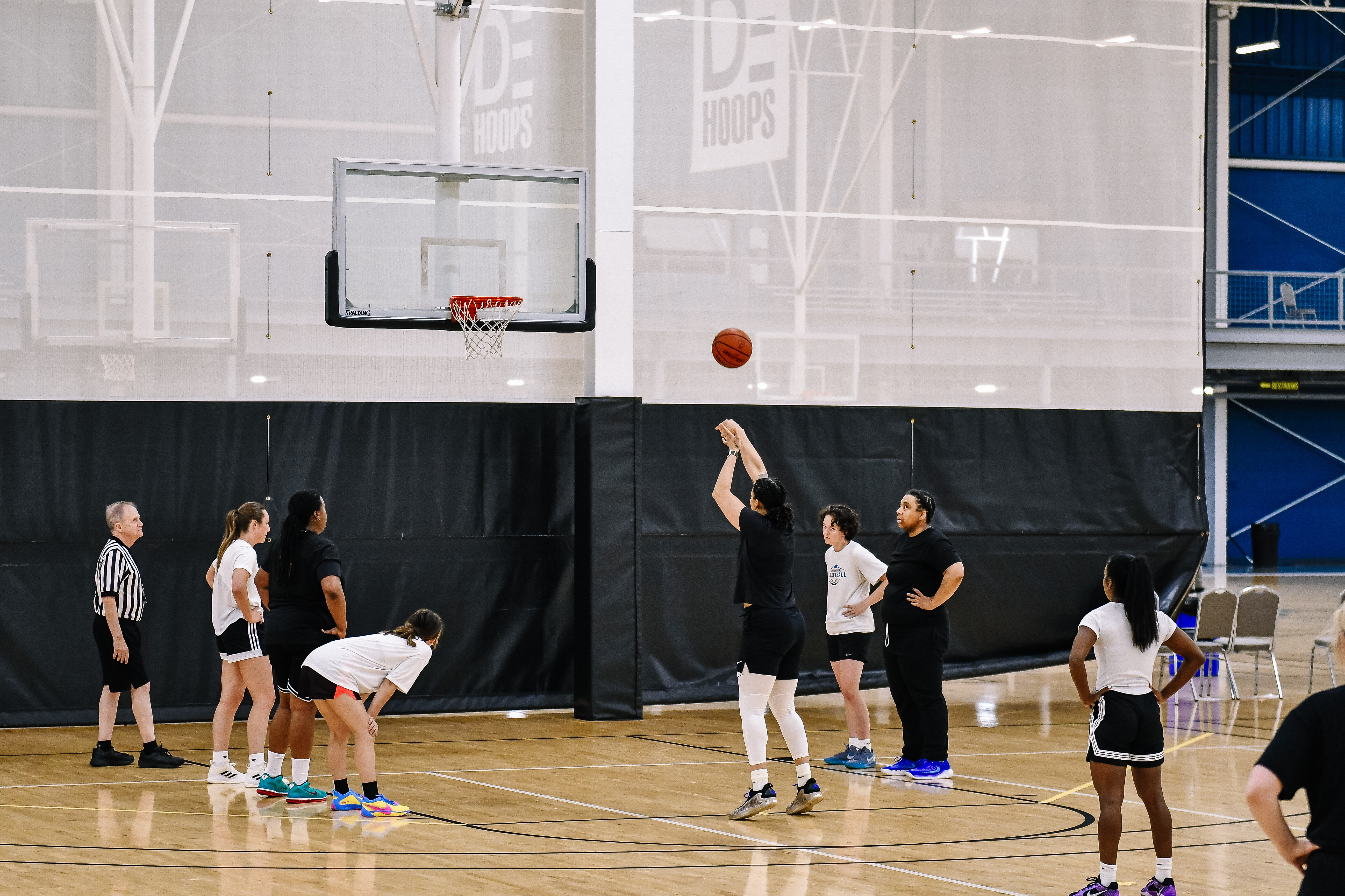 Women playing basketball