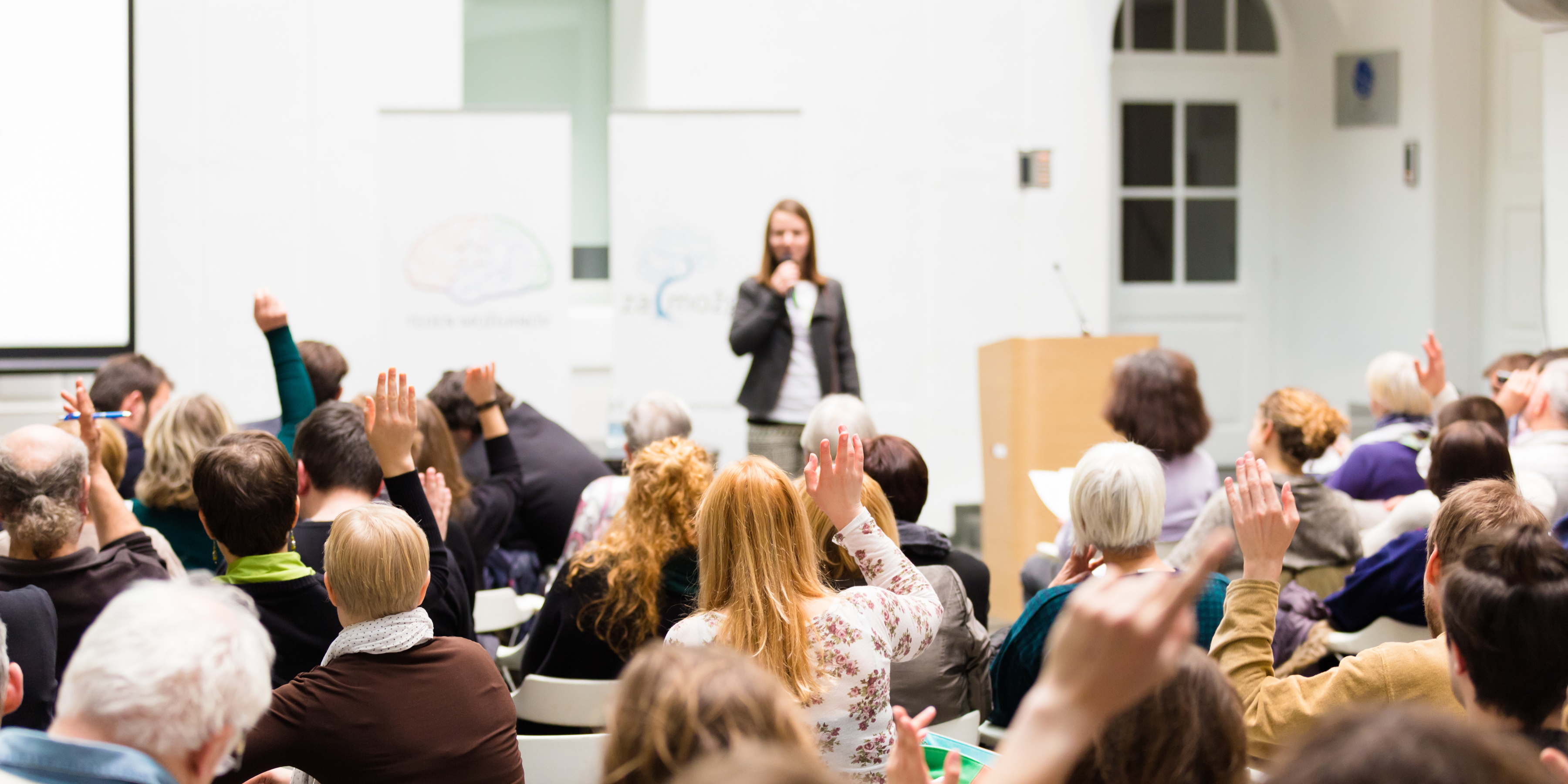 lady speaking to group at event